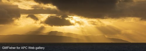 Late light glimpsed over the Small Isles - Gavin Fisher